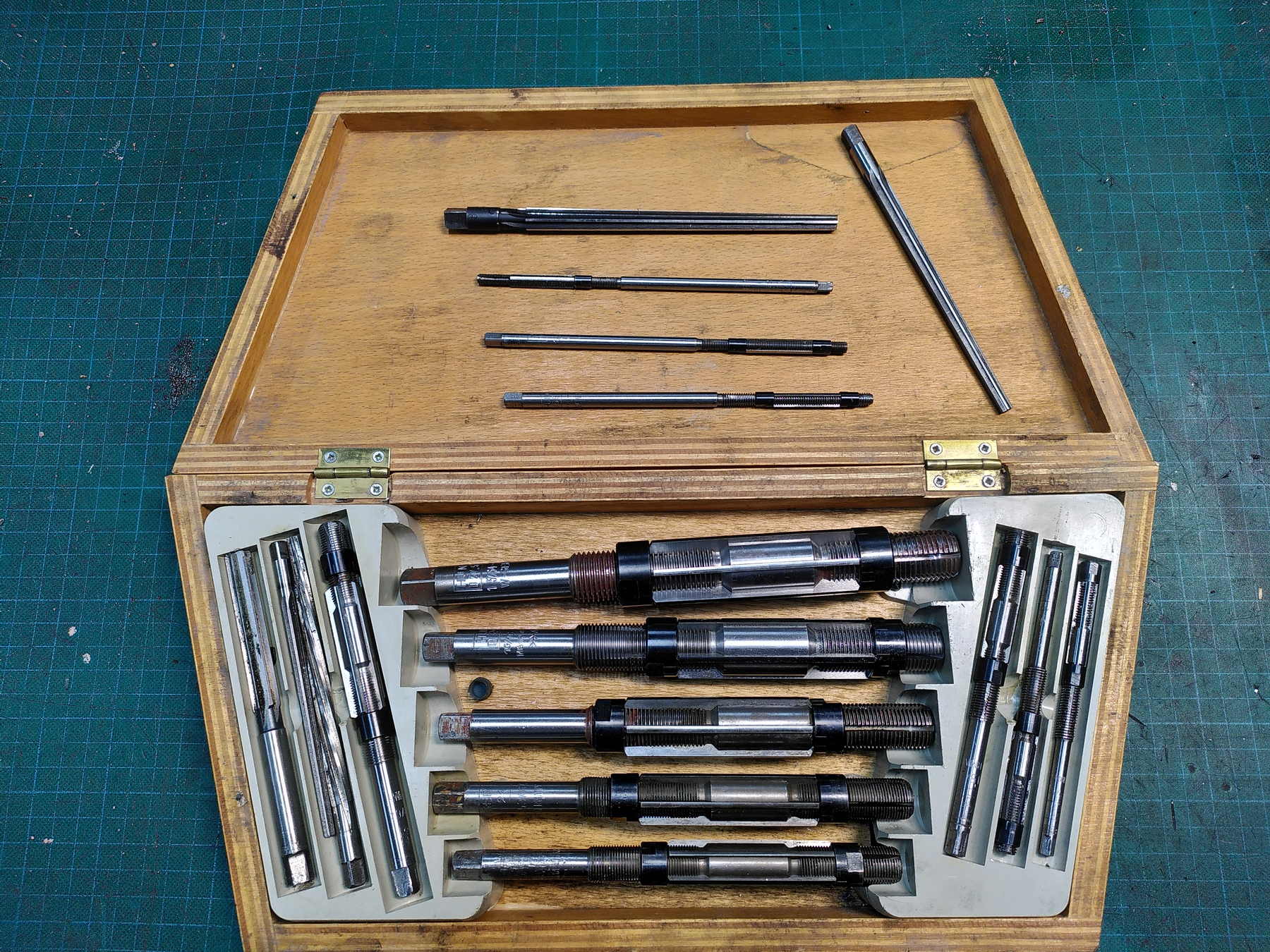 Various adjustable reamers in a Woodenbox